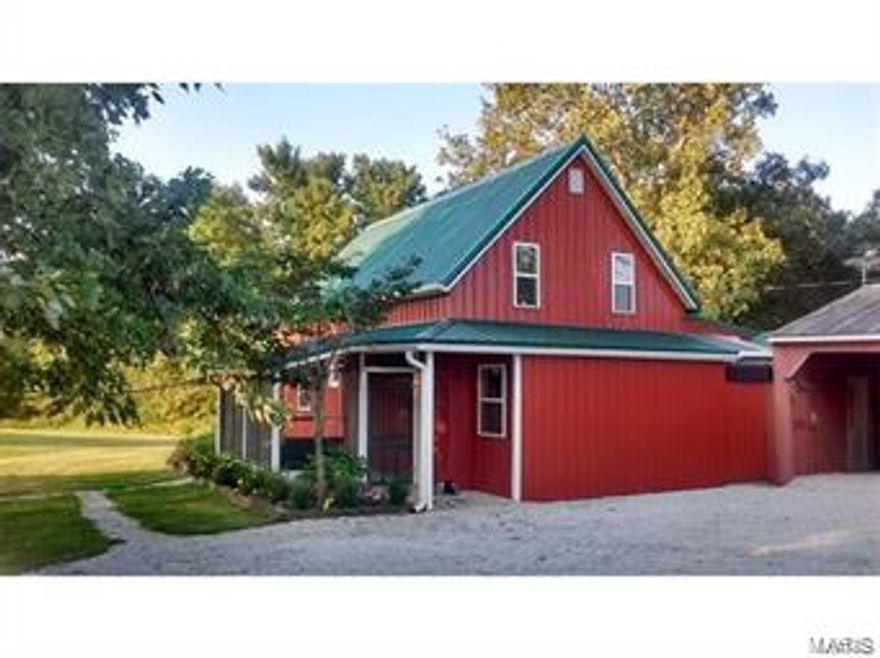 AVAILABLE! Previous buyers financing failed. Peaceful Country Living.This home is a great choice for those looking for a quiet, more private place to live. Get back to nature and enjoy the surroundings. This bungalow has a open floor plan, 2 bedroom, 1 bath with new flooring, fresh paint, lighting and more!Upstairs features a large dormer style bedroom that could easily be 2 bedrooms and plumbed for a 2nd bath. Lots of unique features including French doors to the master bedroom with attached sun room, barn siding, wood plank flooring, and metal cabinets are in good condition.Enjoy summer evenings on the screened porch with swing. 24 x 60 shop building has 2 large sliding doors and wood furnace + carport.Get your garden gloves out...large garden spot, raised beds in place, and grape arbor. The potting shed has electric and you can water your garden with the modern cistern, plus 2 additional cisterns for water storage/collection.The house is on county water. Recent appraisal of $128,000