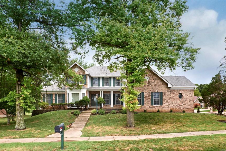 Custom 1.5 Story, first time on market, located in the heart of Chesterfield.  Home boasts over 5300 Sq ft of living area including the finished W/O LL--6 bathrooms!  Entry foyer leads to massive family room with soaring 17 foot ceiling--custom windows flank fireplace; also wet bar and hardwoods. Main level also has formal Dining, library/office, massive kitchen with center island, breakfast room, bay windows, pantry, laundry. Huge Main floor primary bedroom with coved ceiling leads to massive bath that has whirlpool tub, sep shower, and his and hers walk in closets.  Hardwood stairwell leads to 2nd story that provides 4 more spacious bedrooms that have walk in closets, hardwoods, and 2 full bathrooms.  Walk out Lower level is totally finished and has another possible 4 sleeping areas, family room with fireplace, wet bar, kitchen, and another 1 full and 1 half bathroom.  Also, large deck, concrete patio, and extensive landscaping.  Oversized garage is 31 feet deep with 12ft ceiling!!