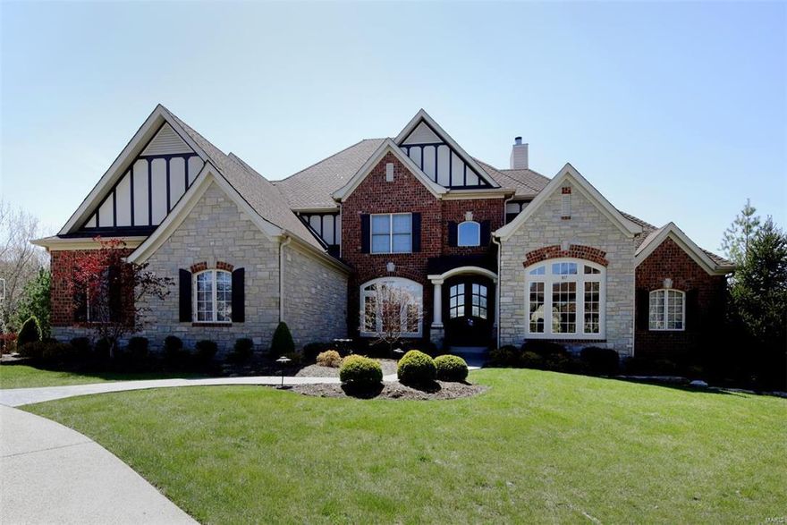 Beautifully designed 1.5 Sty Estate home! Over 6000 sf of living space enhanced by superb craftsmanship & meticulous attention to detail. Impressive 2-sty foyer opens to formal living & dining rooms & coffered family room with fireplace, built-in bookcases & wet bar. State-of-the-art kitchen with granite countertops, 42” glazed cabinetry & center island adjoins breakfast room with bay window & vaulted hearth room with planning center & floor-to-ceiling stone fireplace. Sumptuous master bedroom suite features 2 walk-in closets, sitting room & beautifully appointed bath. 3 Additional bedrooms, 1 with private bath & 2 with Jack n’ Jill bath, plus guest suite with sitting room & laundry complete the 2nd floor living quarters. Walk-out Lower Level includes recreation room with custom built-ins, 2nd kitchen, game room, workout room, office/6th bedroom, gun room, laundry & full bath. Extensively landscaped .75 ac grounds with deck, patio with fireplace & wet bar, pool, hot tub & 4-car garage.