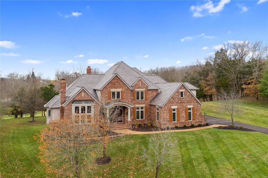 This elegant former Fischer & Frichtel display home sits on one of the finest golf course lots in Cedars Valley. Walls of windows at the rear elevation look out over the patios, the level yard and the Lewis & Clark golf course just beyond. Features include a sweeping front and conveniently located rear staircase, a fully paneled study with built-in cabinets, bookcases and vaulted ceiling. The main floor master is huge and features two walk in closets. The kitchen has Viking and Sub-Zero appliances, granite topped breakfast bar, a planning desk and a two-story hearth room with floor to ceiling stone fireplace. The walk-out lower level includes new carpet throughout, a fifth bedroom with bath, a wet bar and ample storage in the two storage rooms. Other noteworthy items all in 2020: new 50 year roof, new gutters, newer HVAC, newly refinished hardwoods, freshly painted all interior walls, ceilings and garage, new driveway, two smaller HVAC units.