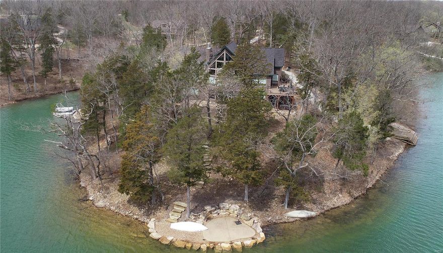 LAKE ALPINE!! The ultimate in lakeside luxury living awaits! This custom-designed, 8-year-old (still like new) raised ranch-style home situated on a point lot boasts panoramic views of the 236-acre lake from almost every room in the house. As you enter the majestic 2-story double door entry, you are greeted by a wall of windows offering majestic views. The main level features a designer kitchen with an island counter and solid surface counters, all opening to a spacious great room with a floor-to-ceiling stone-front fireplace, and the prow of windows providing gorgeous views and plenty of natural light. Separate dining area opens onto spacious deck offering views of the lakeside dock, patio and beach area. The main-level master suite features a separate den/office. Walkout lower level features 3 additional bedrooms, large family room with gas fireplace, wine cellar and plenty of storage. Oversized 3-car garage with additional storage. Fully furnished, ready to start enjoying Innsbrook! Suitable for Bed/Brk