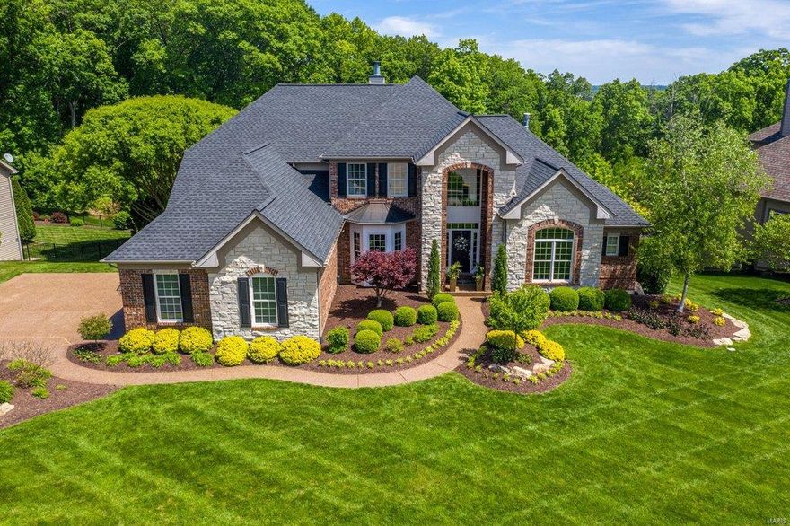 This spectacular brick & stone 1.5 Sty features best-in-class improvements, fixtures & amenities. Situated on a 1.2-acre lot in desirable Austin Ridge. Impressive 2-sty foyer highlighted by flared staircase opens to private study, formal dining room framed by arched entryways & striking great room with marble see-through fireplace, built-in bookcase & dramatic wall of windows with private wooded views. Designer kitchen featuring bisque cabinetry, quartz countertops & Jenn-Air appliances adjoins light-filled breakfast room & hearth room with floor-to-ceiling brick fireplace & atrium door to deck. Coffered master bedroom suite with wide bay window & luxury bath with His & Hers vanities offers a relaxing retreat. The 2nd floor extends the living quarters with 3 additional bedrooms, 1 with ensuite bath & 2 with Jack n’ Jill bath. Walk-out Lower Level includes family room & gathering bar plus guest suite & 1/2 bath. Professionally landscaped grounds with covered deck, patio & 3-car garage.