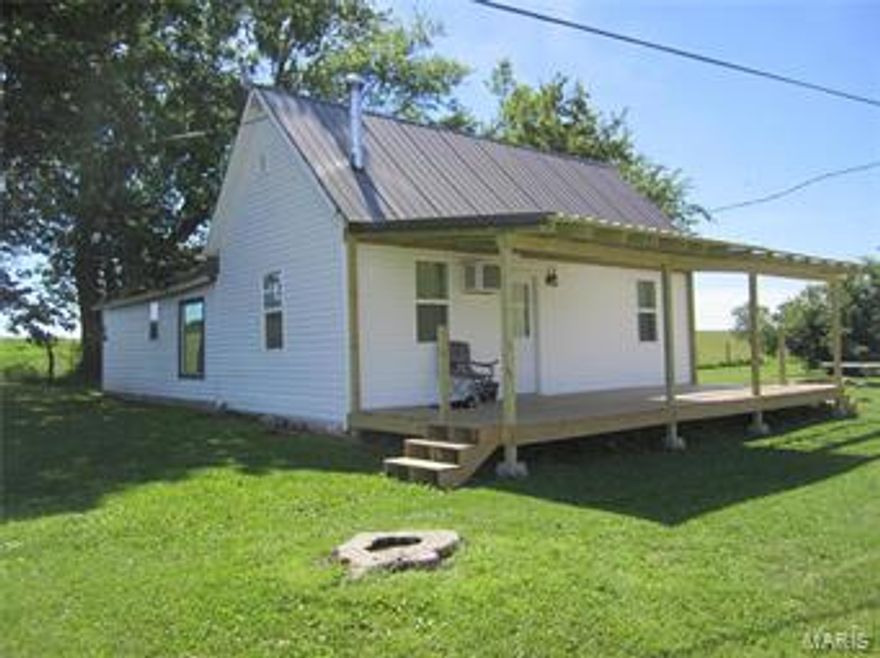 Quaint County home near Pomme de Terre Lake. The new covered front porch welcomes you into the open concept floor plan. This newly remodeled farm house has Pergo floor in the living, dining and master bed rooms, & ceramic tile in the kitchen. The blond finished wood cabinetry goes well with the stainless stove, micro and refrigerator. There is a wood burning stove tucked in the corner of the LR that will heat the whole house.  3 very large bedrooms (no closets) and spacious laundry room.  The sellers are throwing in the washer & dryer too! There is detached garage or shop, garden spot and views of a grass farm behind the home.  This is a great place to call home, be it your 1st home or one to size down too. It would also make a nice weekend destination with the lake a few miles away.