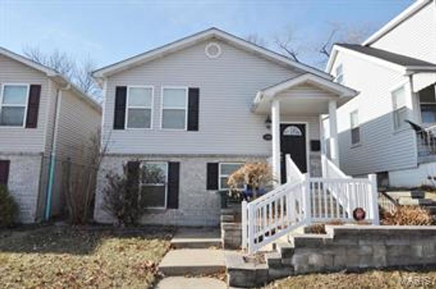 (c.) 2005: this 10yr old 2-level home offers wonderful space & a low-maintenance lifestyle with an affordable price tag! Featuring attractive curb appeal, this 3 bedroom, 2 full bath home offers over 1500 sq ft, 2-car off-street parking and a fully fenced yard. Enter the foyer w/wood floors & wooden steps that lead upstairs to an open concept dining room w/tile floors that opens to a HUGE eat-in kitchen complete w/breakfast bar, loads of raised-panel cabinets, ample counter space, attractive black appliances, can lighting and more. The main level offers 2 generous 13x11 bedrooms (master features 2 dbl-door lrg closets) & a full bath. The lower level offers a large, open family room, an additional bedroom & full bath, just the right amount of storage, plus laundry room. A concrete patio overlooks the level and fully fenced back yard, plus two off-street parking spaces in the private pad out back. Walk to Wilmore Park, River Des Peres Greenway Trail, Sybergs & so much more! Must see!