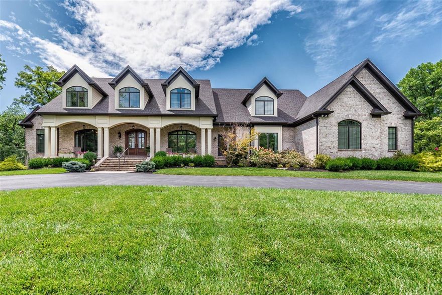 Overlooking 6th green of OWCC grounds this 1.5 Sty custom home was created by Rehnquist in 2015. 8,800+sqft of living space w/ 6+ Bedrooms& 8 Baths, perched on 1.89 acres w/ unparalleled views& Ladue schools. Foyer highlighted by wrought iron balcony leads to custom paneled study, DiningRoom & spectacular GreatRoom w/ 12' ceilings, wetbar, marble fireplace & soaring windows.Open floor plan& center staircase design w/ unique architectural details, custom millwork, hardwood floors, & beautiful lighting throughout. Gourmet eat-in Kitchen w/ SS Wolf appliances, oversized island, granite countertops &vaulted ceilings opens to Hearth & Breakfast Room.  Screened& open deck look out on GolfCourse. MainFloorMaster w/tray ceiling &chandelier leads to MasterBath w dual vanities, walk-in closets& 60" soaking tub. Full GuestSuite on MainFloor. Front&Rear staircases access 4 en-suite guest bedrooms. O/S 4 car garage.Double points of entry to LL w/ rec room, bar, exercise/bedroom& full bath w walkout Additional Rooms: Mud Room COOL: 14 SEER+