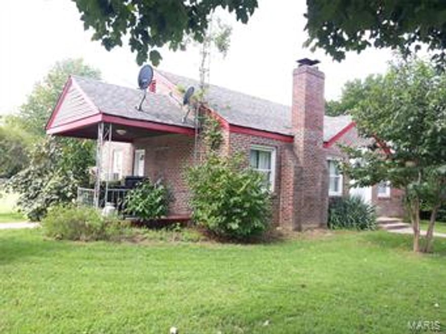 Lovely brick home in Historic Marquand Missouri.  Nice corner lot and extra lots across the alley.  The floors are beautiful hardwood, a full walk-out basement and a detached garage with additional off street parking available.  This is the perfect place to enjoy a small country town.  Located across the street from the city park and within walking distance of grocery store, post office, and Castor River.  Make your appointment to make this your new home.