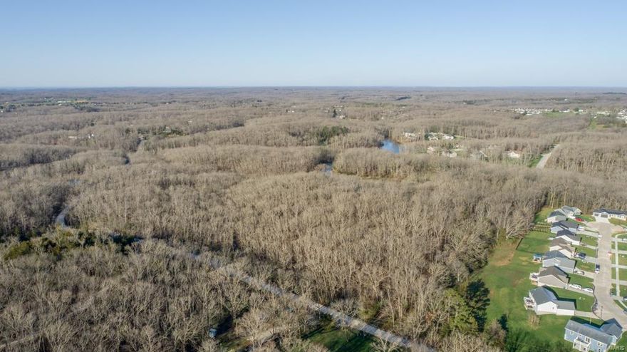 What every one is looking for, a property to be able to spread your wings and get some of that outdoor living but still very close to all the amenities. The first thing you notice is this outdoor heaven that screams great location! Whether looking to build a dream custom home, or develop for larger lot home sites this would be a great fit. Road is already in place to take you straight to the first lake positioned towards the center of the property. When you step out of your vehicle you are welcomed by the beautiful view of the pond sitting in the gently sloping topography. A short walk from the first lake is another pond, both of which are stocked and ready for fishing. As you venture through the rest of this property you will experience a mixture of properties all wrapped up in one. The gently rolling topography changes into a steeper ridge system with rock formations, and a wet weather creek creating the scenic getaway most dream about.