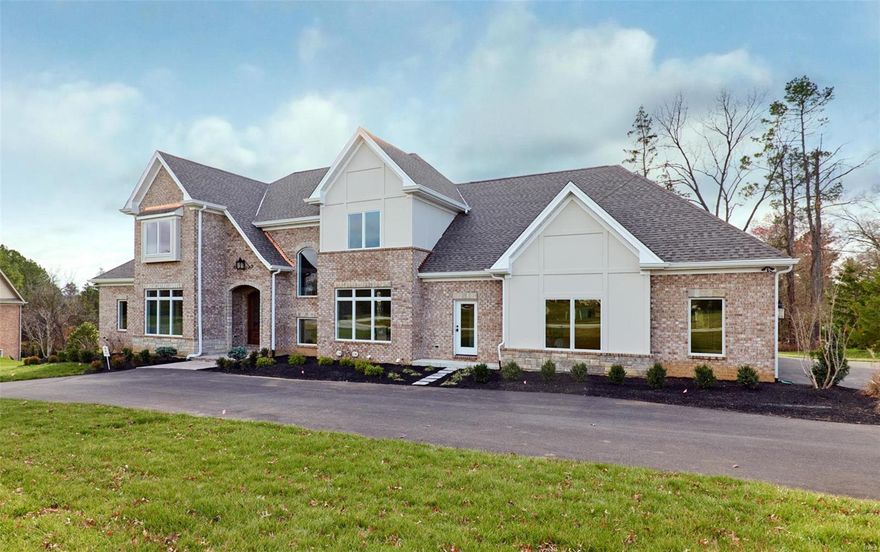 Brand New home ready for immediate move in! Last available home in Stonemont Subdivision! All other homes in this enclave of 6 new homes have sold and are completed.  1.5 story, 4 car garage home offering approx. 4,900 sq. ft. of livable area. This open floor plan features a master suite on the first floor, veranda off the breakfast room and large gathering room with elevated ceilings and sprawling windows along the back providing natural sunlight and views of the woods. Second floor offers three (3) full suites with open bonus room.Seller/Builder is adding pprox.1,700sq.ft. finished lower level at no cost.$ 129,000.00 value. Large entertaining/family room w/wet bar, Full length windows & French doors to walk out patio, Bedroom, Bath, Staircase finished same as first floor, High ceilings w/crown molding Built & designed by Rehnquist Design & Build. Stonemont Subdivision is in an enclave of 6 new homes ranging from $1,825,000 to $2,300,000.