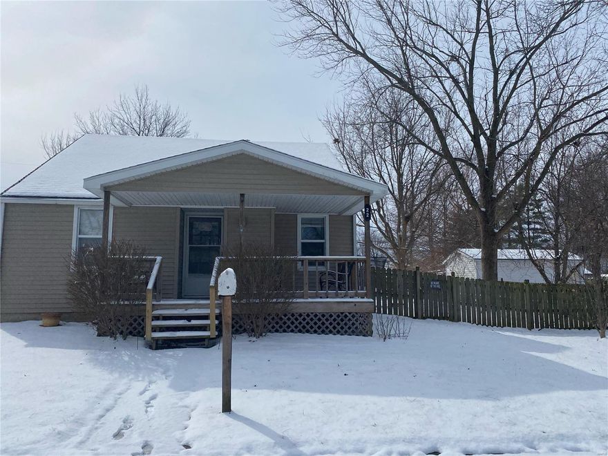 Check out this cozy 2 bedroom home!  Hardwood floors throughout much of the home.  There is plenty of storage space in the full basement, and the two covered porches are a great way to enjoy your evenings.  Nice 2 car garage and fenced-in backyard!  Close to the city park, school, and town square.
