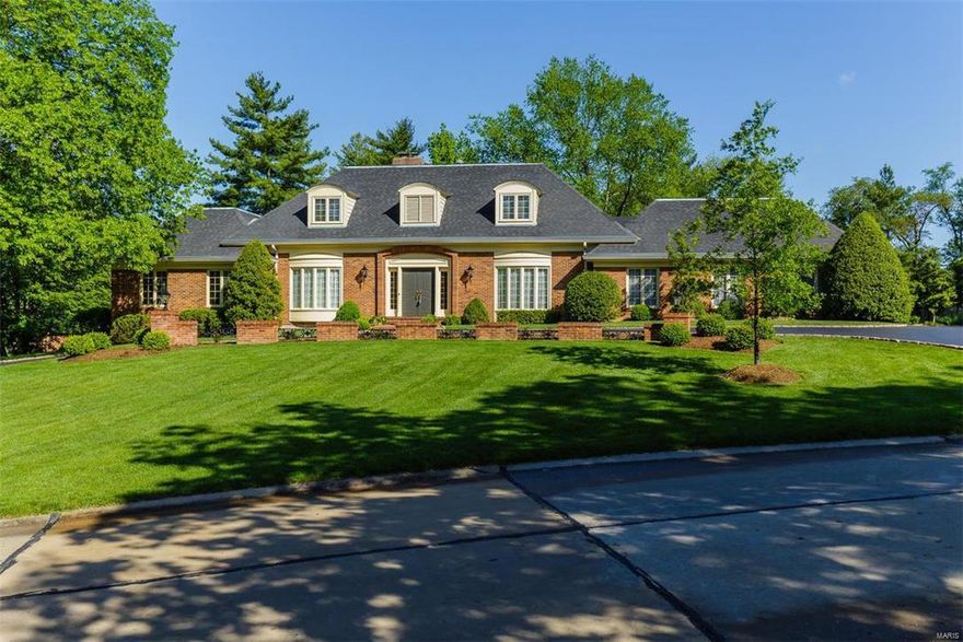 Pull in circular driveway of this spectacular 4-sides brick 1.5 story home in prestigious Kings Glen subdivision of Town and Country.  Higginbotham-built home has wonderful craftsmanship and custom upgrades throughout.  The vaulted entry way w grand staircase welcomes you.  Great Room w gorgeous ash paneling, built-in bar, fireplace and wood floors provides room for entertaining.  There is also a formal Living Room & Dining Room w Butler's Pantry.  The kitchen is updated w Granite Counters and Center Island creating the perfect place for gatherings.  Office features gorgeous floor-to-ceiling bookcases.   Main Floor Master Bedroom suite provides privacy.  Second Level features additional 4 Bedrooms, 2 full baths.  Lower Level is finished with half bath.  Pella Windows. Main Floor laundry. Oversized garage (38/28) w higher door allows for some RVs & Boats. Boasts stairway w direct access to basement.  Level One Acre Lot w Tennis and Full Sports Court. Parkway West Schools. Fabulous Home!