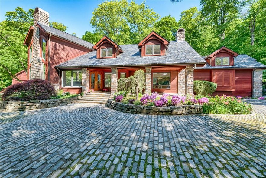 Stunning architecture. Bright, open contemporary design fuses a superlative blend of premium materials & craftsmanship. Nestled on 3 private acres, the home shares 2 private subdivision lakes & tennis court.  2 massive floor-ceiling fireplaces, heated floors throughout, sweeping staircase to upper & lower levels, slate roof, granite cobblestone driveway, gourmet kitchen has Gaggenau gas range, separate electric range/oven & Miele Coffee Maker. Master Suite boasts soaring 2 story ceiling, sitting area, huge closet/dressing room, wall of windows w/ remote controlled blinds. Master bath has full slab Italian marble floor and walls, steam bath & Jacuzzi. Lower level Media Room & Bar w/ full slab travertine walls. Upper level offers a private bedroom suite, gym, office & music area. 3-car gar. AND separate 9-car heated/cooled gar. Heated salt water pool, waterfall, hot tub. 2 story atrium overlooks backyard oasis. Expansive Pella windows complete the views to this extraordinary masterpiece. Additional Rooms: Sun Room