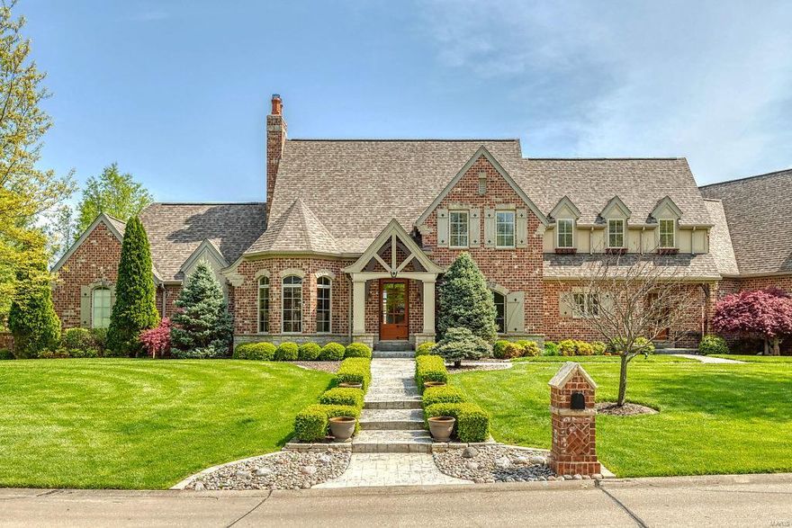 Distinctive architectural elements & superior craftsmanship are featured throughout this spectacular French Country Estate home! Elegant foyer with wood detailing leads to vaulted study with custom built-ins, formal dining room & stunning great room with fireplace flanked by bookcases & dramatic wall of windows. Chef’s kitchen with alderwood cabinetry, granite countertops & 9’ center island adjoins light-filled breakfast room & hearth room with wood-lined ceiling, entertainment center & stone fireplace. Coffered master bedroom with beautifully appointed bath with shower spa offers a relaxing retreat. The 2nd floor extends the living quarters with 3 additional bedrooms, 1 with ensuite bath & 2 with Jack n’ Jill bath, plus expansive bonus room. Lower Level includes recreation room with fireplace & “London Pub,” game room, media rm, wine rm & ½ bath. Situated on a .8-ac lot with 2 patios, deck, 6+ car garage & 2nd garage with service door. Katy Trail is a short walk or bike ride away. Additional Rooms: Mud Room, Wine Cellar