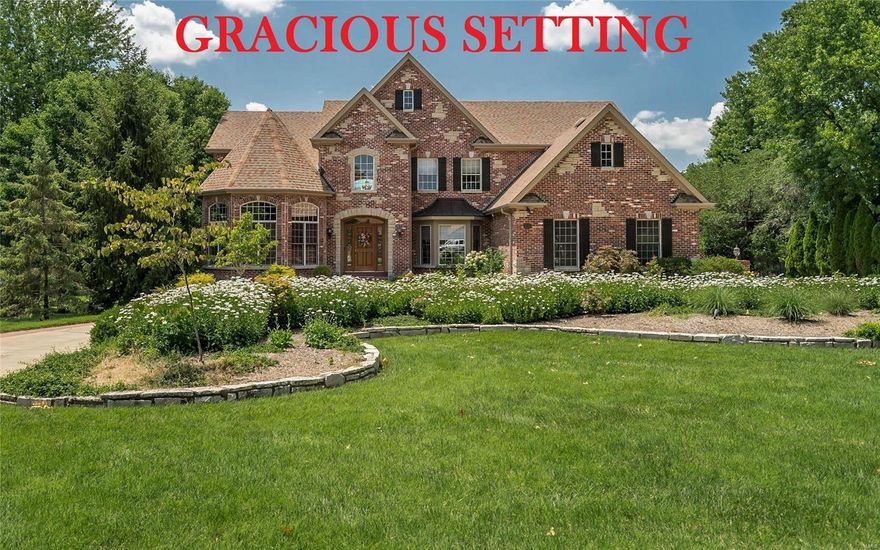 Spectacular brick & stone 1.5 Sty! Over 5600 sf of living space enhanced by gleaming wood floors, soaring ceilings, custom built-ins & integrated sound system. 2-Sty hardwood foyer leads library-paneled study with 18’ octagonal ceiling, elegant dining room & stunning great room with marble fireplace flanked by 2-sty windows & atrium doors to veranda. Chef’s kitchen with 42” cherry cabinetry, premium appliances & convenient planning center adjoins vaulted breakfast room with wide bay window & hearth room highlighted by marble fireplace. Coffered master bedroom suite with luxury bath with Jacuzzi offers a relaxing retreat. The 2nd floor extends the living quarters with 3 additional bedrooms, 1 with ensuite bath & 2 with Jack n’ Jill bath. Lower Level entertainment space includes recreation room with gathering bar, game room & media room plus workout room, 5th bedroom & full bath with sauna. Situated on a 1-ac lot with veranda, loggia & resort style pool surrounded by landscaped gardens.