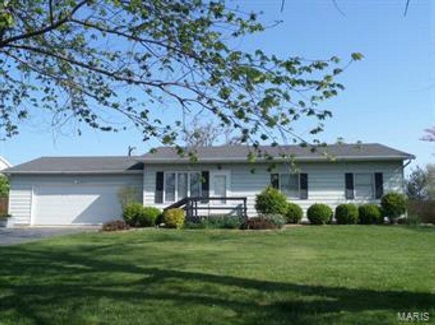Wonderful home on the outskirts of town with a gorgeous yard to go along!  This home has a lot to offer at an affordable price.  Three bedrooms with one and half baths on the main level.  Many updates have been completed since ownership in 2004.  Roof was replaced in 2008, deck in 2009,  GAFA in 2011, privacy fence replace with in the last couple of years, new deck door, and septic tank updated.  The full basement is mostly finished with a nice family room, bedroom, separate laundry and plenty of storage.  Two car attached garage will comfortable fit two larger vehicles.  Don't forget the gorgeous back yard with garden shed, patio, and fully fenced for your privacy.  Don't miss this great house!