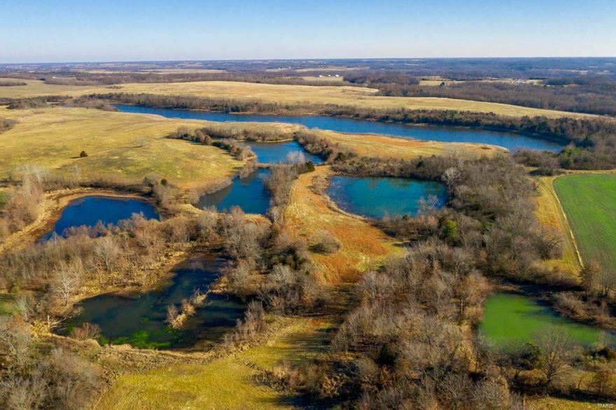 This Westlake farm has been in the same family for more than 70 years and is one of the finest, most diverse farms you will find anywhere.  Located just northwest of Huntsville, Mo this property has everything you are looking for with nearly 1516 continuous acres that are filled with exceptional tillable, pasture and recreational opportunities. The recreational aspect of this farm is off the charts, with more than 1500 continuous acres, 17 lakes and ponds, river access and plenty of food for the wildlife.  The terrain is made up of rolling pasture that will make you think you are hunting in the middle of Kansas, prime river bottom that is just littered with deer and turkey sign, and a 30 acre lake that was just chocked full of ducks.   Not only are the lakes and ponds great goose and duck hunting but they are fully stocked and offer some incredible fishing as well.  Property generates $80,000 dollars in income from the same tenant who has farmed it for years.