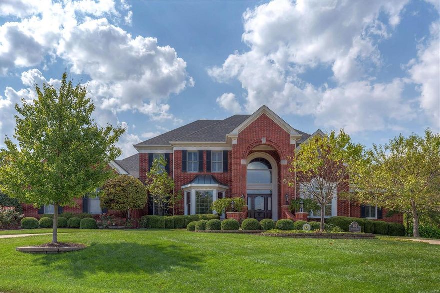 Spectacular 1.5-sty Estate home! Prominently situated at the end of the cul-de-sac, this custom-built home with its circular drive & impeccable landscaping makes a stunning entrance. Grand 2-sty marble foyer leads to library-paneled study & 2-sty great room with marble fireplace, wet bar & dramatic wall of windows. Exceptionally large kitchen with 42” cherry cabinetry, granite countertops, Dacor appliances, butler’s pantry & center island adjoins light-filled breakfast room & vaulted hearth room highlighted by floor-to-ceiling stone fireplace. Sumptuous master bedroom suite features huge walk¬-in closet, sitting room & lavish bath with sauna & Jacuzzi. Front & rear staircases access 3 additional bedrooms, 1 with ensuite bath & 2 with Jack n’ Jill bath. Incredible Lower Level includes recreation room with entertainment center, game room, 2nd kitchen, workout room & full bath.  Premium .66-ac lot with outdoor family room with grill center & stone fireplace, patio, hot tub & 3-car garage.