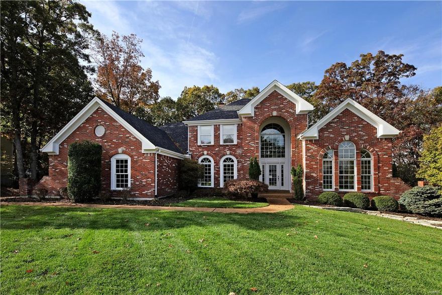 Located on a beautiful wooded lot, this spectacular 1.5 story luxury home has exceptional design features and upgrades throughout!  Impressive two story foyer leads to private study with 12’ ceiling, built in bookcases & French doors, elegant dining room w/extensive mill work, & expansive great room with marble fireplace, wet bar, & wide bay window.  Main level coffered master bedroom suite with huge walk-in closet and lavish bath offers an appealing retreat.  Three large bedrooms upstairs have walk-in closet, one Jack and Jill bath and one private bath.  Spacious open kitchen w/custom cabinetry, stainless appliances, double pantry, center island w/cooktop and breakfast bar adjoins a vaulted breakfast room and hearth room with fireplace. Professionally finished walk-out lower level includes enormous recreation room with walk behind wet bar, billiard/game room, work out room, secondary laundry, bedroom and full bath. Neighborhood community has two pools, tennis courts & walking trails.