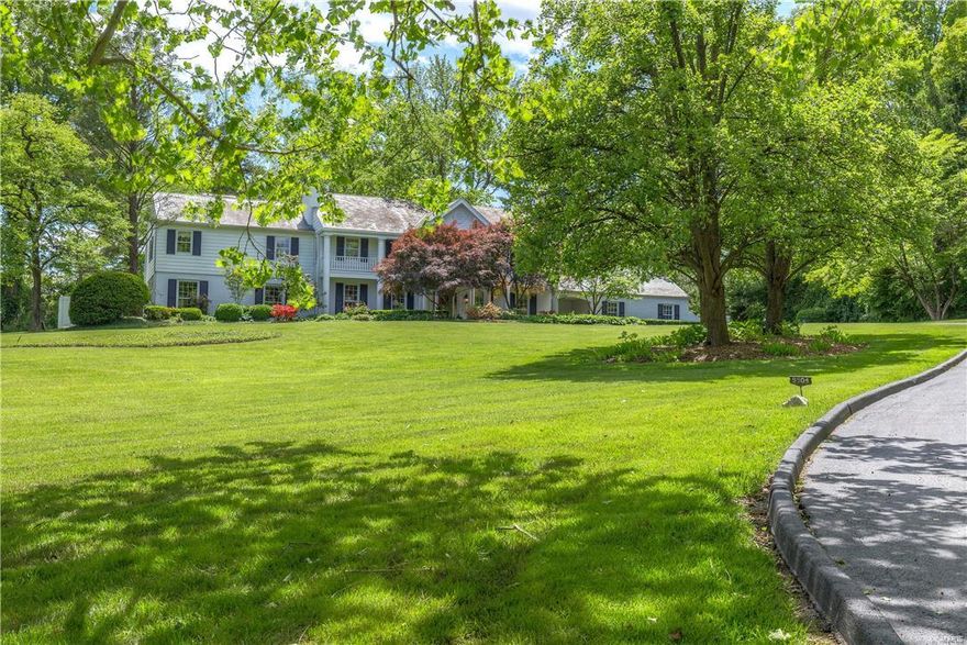 A private oasis on over 2.5 acres which is hidden from the street. Large kitchen/family/breakfast room with granite counter tops, a wall of windows overlooking a private patio, with mudroom/pantry entrance, and an attached butler's pantry with an additional dishwasher and sink making entertaining a dream. Another spacious family room overlooking the private side yard with access to the newer screen porch featuring gas fireplace and outdoor TV. In addition there is a guest suite with sitting room and private bath on the first floor and a good size home office with fireplace.  Large master bedroom suite includes a fireplace, a dressing room with multiple closets and a built in dressing table, large bath with double sinks, soaking tub, wonderful shower with body jets, and then there is a large room entering the master that has a closet and shares a bathroom...could be a sitting room, office or nursery.  4 other bedrooms and porch room on second floor. 3 car gar, 3+ carport spcs. Generator