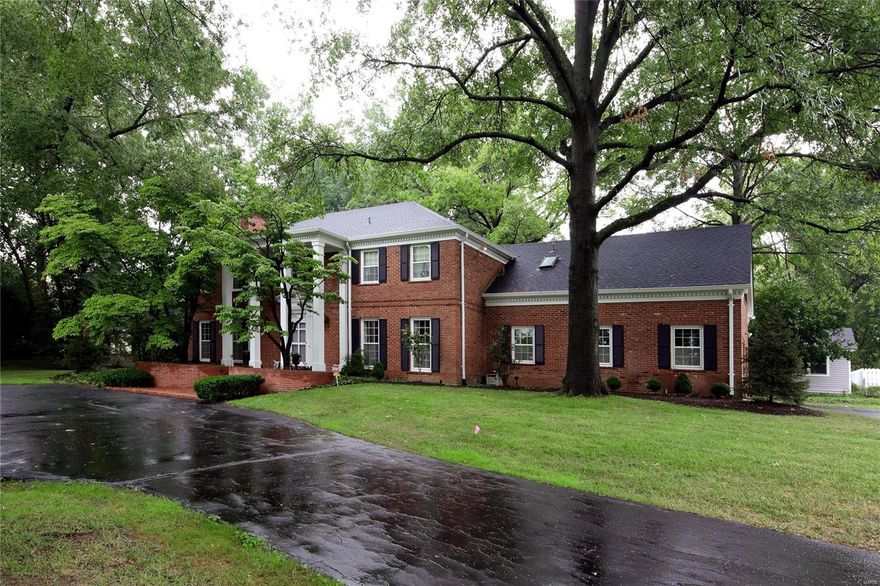 Custom built in 1966 by current owners, this elegant 2-story center hall traditional colonial, sits on 1.8 acres in on one of Ladue’s most sought-after lanes.  Inviting foyer leads to cozy family room with bar and wood burning fireplace.  Formal living room has built-in bookshelves, custom millwork and wood burning fireplace.  Large kitchen with custom cabinetry, breakfast bar and dining area. All three rooms have French doors accessing the multi-level brick patios leading to the pool and pool house / painting studio, offering possibilities for a guest cottage, having a kitchenette and bathroom.  Beautiful, sizable dining room.  Hard wood floors throughout main level.
Second floor offers 6 bedrooms.  Master bedroom suite includes gas fireplace, ample walk-in closet and bathroom with jet tub, separate shower and dual vanities.
Situated on an elevated lot with mature gardens, trees and landscaping, this estate offers a tranquil, private setting in the heart of Ladue.