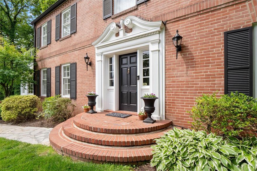 FRESH NEW LOOK & STAGING! PLUS...NEW PRIMARY BATH COMPLETED! Classic Ladue center hall on sought-after Loren Woods Dr. Gracious entry foyer, winding staircase.  Formal LR w/ hardwood floors, built-in bookcases, plantation shutters, wainscoting & fireplace w/ marble surround. Formal DR opens to large family room w/ 2 large bay windows, 18" x 18" travertine floors, wet bar & French doors lead to 2 level deck. Updated kitchen w/ new carrara marble counter tops, 6 burner Viking range, Bosch dbl. ovens Subzero fridge, built-in desk w/adjoining screened-in porch w/ brick floor ideal for al fresco dining or easy to enclose. 1st floor laundry room + full bath w/ marble floors & walk-in shower. 2nd floor features master suite w/ dressing room, 2 closets, NEW master bath with white Carrara marble & vessel soaking tub.  Add'l 3 bdrms,3 baths complete the 2nd flr. Finished lower ideal for a play room or home office.  Wooded, terraced lot w/ stone retaining wall, lots of sq. footage for the $$$.