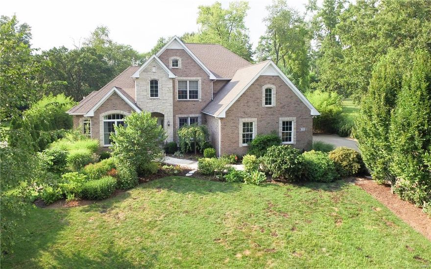 Exceptionally appointed custom built 9 year old 1.5 sty. Quiet street. Beautifully landscaped. Park like backyard w custom stone patio & unique water fall. Impressive spacious 2 story entry. House lives large w great open spaces. Gather one or all at lg center island in gourmet kitchen w top of line stainless appliances, granite counters, multiple sinks, custom cabinetry & blt-in coffee maker. Enjoy hearth rm w fpl or proceed to great patio for entertaining. Lg FR w fpl. Wonderful owners suite w fpl & French doors to patio. Lg main flr utility & pantry. Up lg additional FR w bookcases, 3 Bdrms, 1 is suite, 2 share Jack & Jill bath. Fantastic finished versatile LL being used as exercise, rec/family & media areas plus office, full bath & 2nd lg utility rm. Abundant Brazilian cherry wood floors, some slate flooring, extensive use of moldings, upgraded lighting, 3 fireplaces, Control 4 media/sound system, 3 car heated garage, back-up generator. New architectural roof to be installed 9/16.