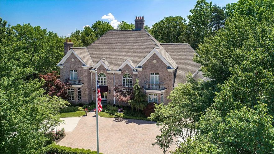 Exceptional home in desirable Ballantrae.  Finishes & attention to detail are exceptional from the 20 ft ceilings in the living room and dining room to the intricate moldings found throughout the home.  The gracious 2 sty foyer is flanked by a warm and inviting library and office on one side and a living room that is truly a masterpiece.  The dining room is spacious with detailed molding.  The great room has a wall of windows and french doors providing easy access to the maintenance free deck.  The kitchen is a chef's delight with ample counter space, an island with seating for 4 and is  open to the breakfast area with a beautiful bow window. 1st floor laundry room &activity room complete the first floor.  All 2nd floor  en-suite bedrooms are spacious and light filled, plus an in-law suite.   The finished lower level features an office, exercise/pool room, media room and bedroom and bath.  The LL family room provides more quality living space as well as access to another patio area.