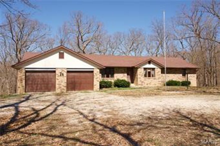 Sitting 2.8 Miles East of Clarence, Mo and 2.8 Miles North of Highway 36 sits this beautiful secluded roughly 2150 sq. ft. ranch style house.  Built in 1993 the house sits on 10 Acres of mostly White Oak Timber.    Pulling into the drive you soon realize how private of a setting you will soon be living in.  Once getting inside the ample space provided will be enough for even the largest of families.   There is a very large kitchen and dining area.  3 bedrooms off the east end of the house with the master having a very large bathroom.  IF you wanted to add a door to the spare room you could turn this house into a 4 bedroom very easily. The house sits  on a full basement with a walk out and a garage door.  House has a geothermal heating and cooling unit which is around 4 years old.  If you want privacy  and a large well constructed house that  you can put your own touches on this is the one for you!