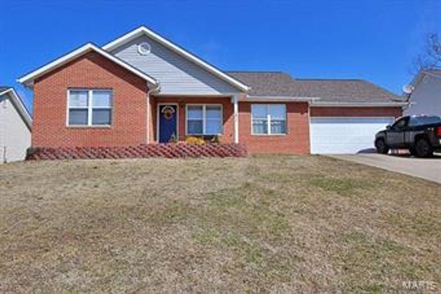 Brick and vinyl ranch has 3 bedrooms on the main level and a 4th bedroom in the mostly finished lower level.
