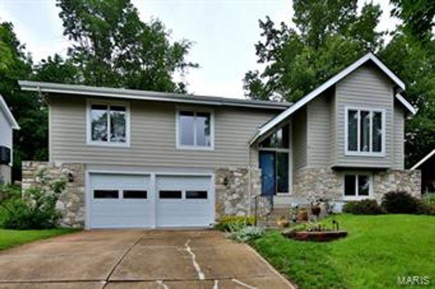 Dramatic updated contemporary home with many improvements through out. 4-Bedrooms, 3-full baths. The open great room features a vaulted ceiling with skylights, floor to ceiling stone fireplace and offers amazing views of the a private yard against a wooded backdrop. Newer hardwood floors, gourmet eat-in kitchen with granite tops, formal dining room, plus a spacious master suite with 2-walk-in closets and the master bath has been updated and has double vanities, separate tub and shower. There are 2-guest bedrooms and an updated hall bath with a new vanity, fixtures and ceramic tile. The lower level is finished with a rec room, brick fireplace and there's a 4th bedroom and a full bath. There's additional storage plus an oversized 2-car garage. The yard must be seen, the private setting along with a screened gazebo create a tranquil environment. Great central location in desirable Ridgemont Subdivision, minutes from highways and shopping centers. Parkway schools.