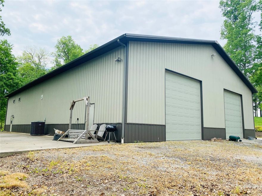 Who doesn't love a shop house? This custom built 88x60 shop is sitting cozy next to a shared lake and 4.32 beautiful acres.  2 entrances in/out make this a very functional and great place to call home. Additional Rooms: Mud Room