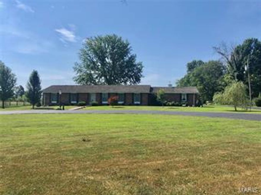 Great home with lots of potential. Additional detached garage. Beautiful 9 acres. Close to town!