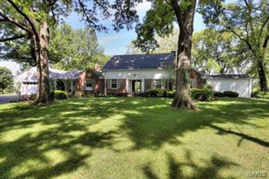 Spectacular is the impression when entering this 1&1/2 story home.The view from the living room wall of windows is of a large brick patio and the beautiful golf course and pond of Westwood Country Club. Entertaining is easy with the open living room,featuring a gas fireplace and custom cabinets and spacious dining area.An adjoining family room with wet bar, Colorado stone fire place  has a counter and pass thru to the cooks kitchen, recently remodeled,the counters are granite,and the cooktop gas.The master bedroom suite,another gorgeous view, has exceptional dressing space and closets,a spa like stunning bathroom and washer/dryer,(they stay) ,enhances the comfort level.There is a second bedroom or office on this floor.Upstairs two additional bedrooms and a bath. An oversize two car garage,many closets  are some of the extra features. Convenient to all the Ballas medical facilities yet because of the mature trees very private and serene.