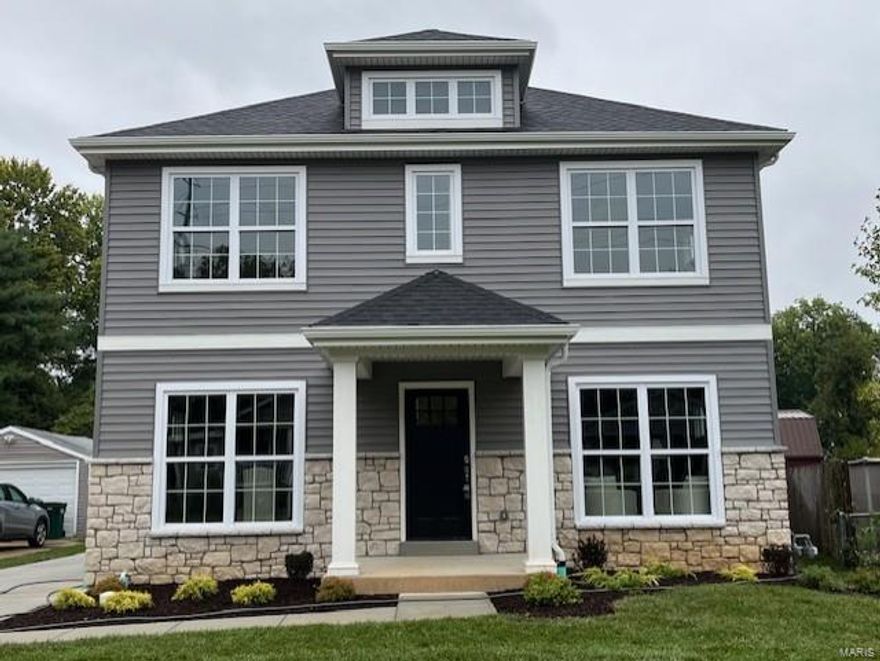 New custom modern farmhouse home in Webster Groves by Schindler Custom Homes.  This 5 bedroom, 3.5 bath home features 9' first floor ceilings, hardwood flooring all of 1st floor and 2nd floor hall, full overlay custom kitchen cabinets with soft close solid wood drawers, crown molding, stainless steel appliances, Quartz countertops with undermount sink, under cabinet lighting, butler's pantry, coffered ceiling in master bedroom, luxurious master bath with double sinks, separate tub and large shower, 2nd floor laundry room, and walk-in closets, Quartz.granite countertops in all baths, custom millwork with 3-panel doors, 3 1/4 inch casing and 5 1/4 inch base molding.  Finished lower level with rec room, LVP flooring, full bath, and bedroom.  Fully sodded yard, 1 year builder warranty and 10 year structural warranty.