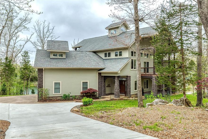 This magnificent one-of-a-kind vacation or permanent home sits waterfront on Lake Alpine w/a beautiful shoreline. The view of the 200+acre lake is just the beginning of what makes this home spectacular. Each detail has a story, from the architectural style which was patterned after barns of the Midwest to the reclaimed wood floor and custom loft railings. Fireplace designed from copper & muntz metal; open floor plan with stunning gallery view makes this the perfect home for entertaining. The 2.3-acre lot features a walking sculpture garden by renowned artist that stays w/the home; spend your days on the dock to soak up all of the summer ahead. Features inc main level primary suite w/fireplace; gallery loft with guest suite; 3 levels of deck/patio; Mosler safe room; geo-thermal system for max efficiency & low utilities; stainless steel chef's kitchen; walkout LL w/bedroom, bath, large rec room, fireplace; oversized garage for RV or boat. This home is an artist-inspired must-see!