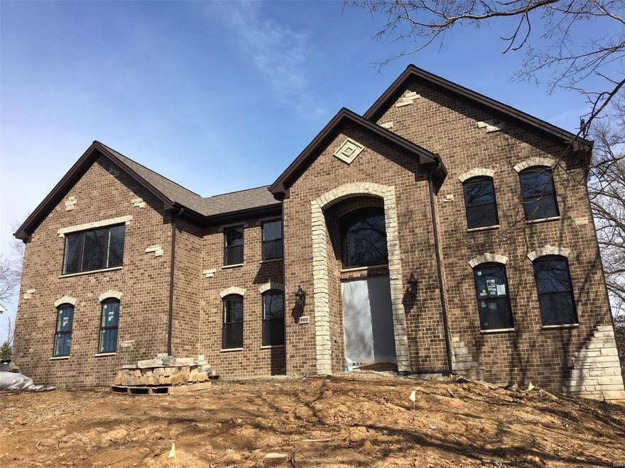 Impressive Sophistication Best describes this Sprawling Stone & Brick 2 Story. 5 Bedrooms, 4.5 Baths, & Almost 5000 sq ft of well appointed Living Space! Thoughtfully designed for todays Lifestyle. Awesome 2 sty Entry greets you, flanked by Formal dining rm, & Study/Formal Living Rm. Incredible Gourmet Kitchen is sure to please any chef, w/ center island/Breakfst Bar, Custom Cabinetry, Premium Granite, SS Professional Series Appliances, & Butlers Pantry/Docking Station! Breakfast Rm & a Spacious Great Rm finish off the Heart of this Home! A "knock your socks off" Master suite awaits you on the 2 flr, LUX Bath, w/ marble flooring, Custom (oversized) Rain Shower,  Floating Tub & Massive closet compliment the coffered/chandeliered ceiling of the IMPRESSIVE Master Bdrm! Jack & Jill Bedrooms, along w/ 3rd bdrm, Full bath, Loft, & 2nd flr Laundry round off this level. Professionally finished LL, 5th Bdrm, Rainshower FB, & (wired) Surround Sound Rec Room- Energy Efficient, & Quality Built. COOL: 14 SEER+