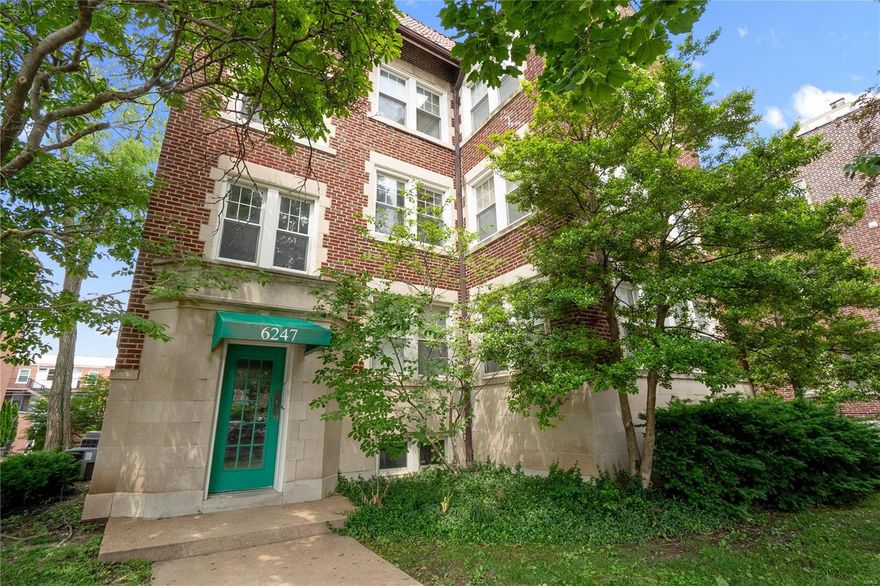 Welcome to this charming first-floor condo close to Wash U, Clayton, Forest Park, and more! Upon entering, you are greeted by a bright foyer and beautiful hardwood floors that flow throughout the unit. The kitchen boasts new appliances, ample pantry space, custom cabinetry, granite counters, and a breakfast bar. The open living and dining areas create a spacious atmosphere, leading to a large, covered deck. The primary bedroom offers dual closets and an en-suite bathroom. The secondary bedroom with a second bathroom is great for guests. In-unit washer/dryer. One private garage space and additional storage in the basement. Explore dining and shopping in the DeMun area or head to Wash U. for class. Catch a movie at HI Pointe Theater, grab a coffee at Kaldis, or enjoy a sweet treat from Clementines Ice Cream. Easy proximity to Clayton, Forest Park, and the Zoo. Location: Ground Level