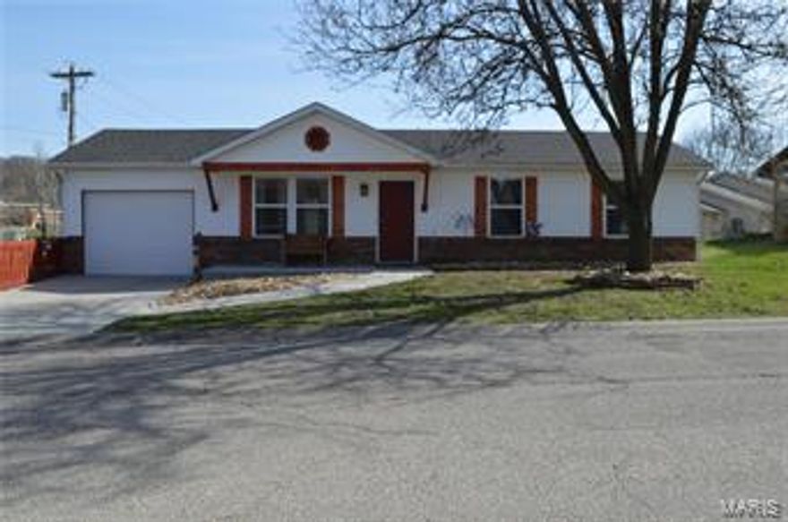 This nicely updated Ranch home sits on large level city lot in Hermann on the corner of HWY 100 and Frene across the hwy from the school. This home was updated 18 months or so ago.  Newer Roof, newer water heater,  laminate wood floor in the living area, tile in the kitchen, laundry  and bathrooms.  Open kitchen and living area. Fenced back yard for pets and children. Sits on the corner lot and provides a feeling of wide open space.  Sit on the back patio or the covered front porch and catch the trolly right out your front door! Over sized one car garage ( deeper)  with entry into the utility room.
Owner is relocating and some of the furniture may be for sale. Owner maybe taking blinds/curtain rods/tv and speakers. ( wires for speakers will be left) Owner has a Home warranty that is transferable expires in October 2018.