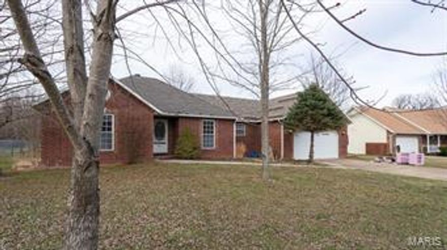 Wonderful 3/4 brick family home with lots of extra's located on the outskirts of town. This well built home has 3 generous bedrooms, a formal dining room, 6 panel wood doors, some hardwood floors, central vacuum system, and a brand new roof! The home has vaulted ceiling in the open living room that boast a wall of built in shelving and a warm and inviting wood fireplace. The large lot is fully fenced for your pets with a nice private feeling back yard. The open kitchen has oak cabinets, a nice peninsula with breakfast bar, and a $2500 allowance for new appliances of your choice. Don't pass up the chance to make this home yours!