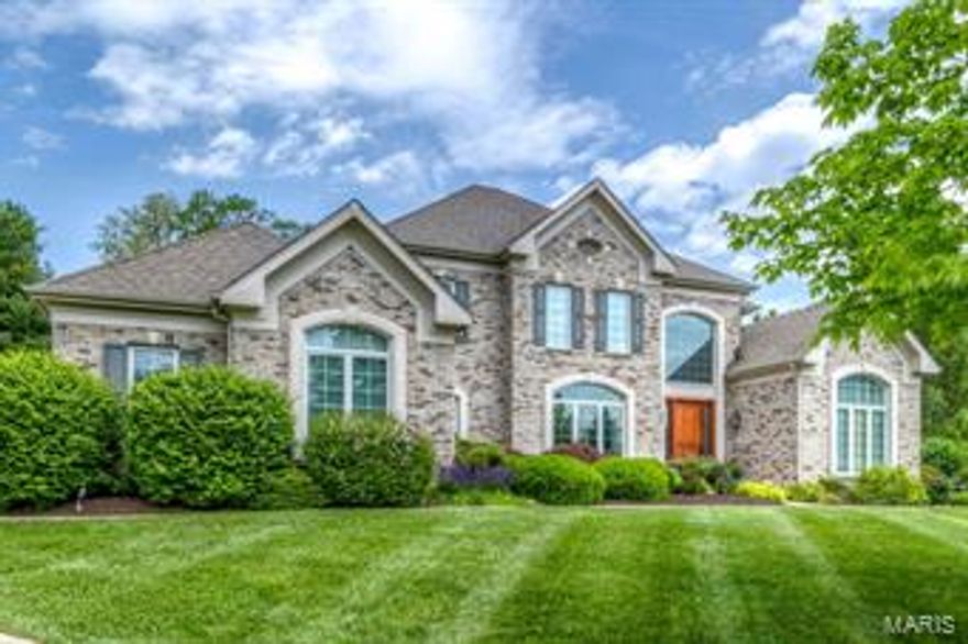 Incredible Estate on private acre lot! One of the Best! 1 1/2 Story-with Great Privacy and top of the line features! Luxury Interior Amenities: Two Story Entry-Palladian & Huge Windows-Hardwood-Dining Room-Hall-Kitchen-Breakfast Room-Hearth Room. Lots of Custom Built-ins  & Crown Molding. Great Room-Floor to Ceiling Windows-Walk Behind Wet Bar-Granite counters-Custom Cabinetry. Spacious Kitchen with Large Center Island, Granite and Upgraded Appliances. Exquisite Lighting, Updated Master Suite on Main Level with his and hers closets-Beautiful Hearth Room-Windows Galore-Second Floor: Office area plus -Three Bedrooms-Jack & Jill plus Private Bath. Lower Level Equally Striking-Rec Room-Billiard Area-Exercise Room-Office- Possible 5th Bedroom & Full Bath-Bar & Wine closet. Privacy on Acre lot backing to trees at the end of a cul de sac boasts Large Covered Patio off kitchen with built in grill, Inground free form Pool with waterfall, Newer Spa. This home is a must see before it's gone.