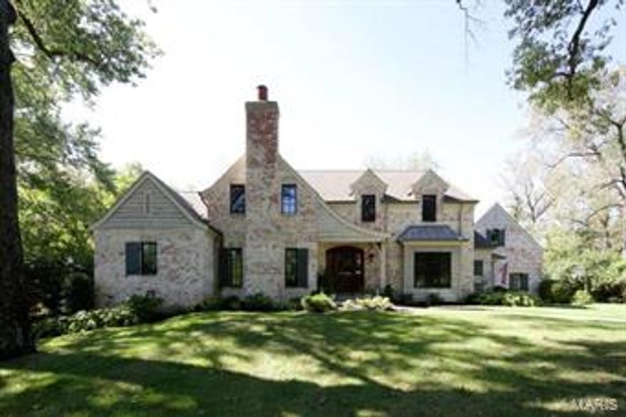 Gorgeous authentic French Country designed custom home. Built 9 years ago by Hennessey. One of the best lots in Ladue Manor.   Fabulous Ladue neighborhood walking distance to Reed Elem or Community School!  This home has everything you are looking for...open floorplan features gourmet kitchen with large gathering island open to Breakfast and 2 sty Hearth Room with floor to ceiling stone fireplace.  Hearth Rm has built-in bookcases & french doors leading to flagstone patio with built-in fire pit. Rear yard backs to woods.  Main floor master retreat has luxurious bath with jetted tub, heated floors & his/her walk in closets.  2nd floor has 3 charming dormered ceiling bedrooms all with en suite baths.  There is a large bonus room/5th bedroom/inlaw quarters with full bath over the 3 car garage.  This home also features plantation shutters, hardwood floors, in ground sprinkler system, alarm system, built in sound system, Move-in ready!!