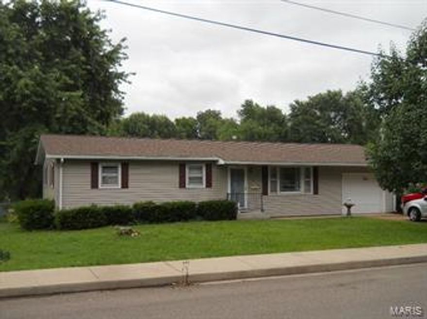 What a find!  Three bedroom ranch home on level corner lot, with fenced back yard, covered patio, and 16x12 screened in  deck.  Vinyl siding, new roof, corner lot, and garage.  Home is cozy and well maintained, ready for a new owner.  Appliances stay.  Even has a backup gas heater for power outages!  Just a few blocks from Karsch Blvd. in Farmington, so close to everything!  Call today before it's gone!