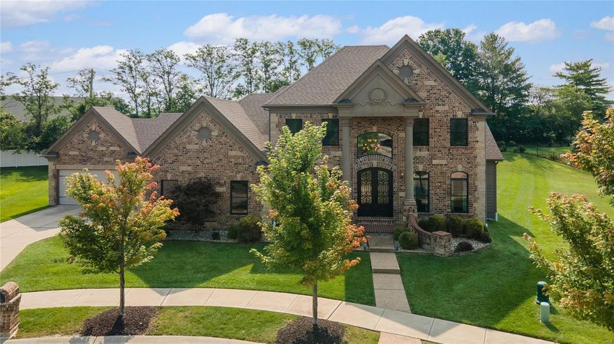 Experience upscale living in the Enclaves of Cherry Hills! This 5-bedroom, 4.5-bathroom beauty boasts over 5,000 sq ft of pure luxury. Enter through the grand 2-story foyer with marble flooring, leading to a bright great room with a wall of windows and adjacent to a private office and separate dining space. The kitchen is a dream with stainless steel appliances, sleek granite countertops, a central island, and a charming hearth room opening to a cozy backyard patio and level backyard that backs to trees. The main floor primary bedroom offers a luxury en-suite bath with separate shower, dual vanities and two walk-in closets. Upstairs, find 3 roomy bedrooms and 2 full baths. The finished basement is an entertainers dream with a full bar,  recreation space, a media room, an extra bedroom, and yet another full bath. Enjoy the community pool, scenic walking paths, and the vibrant Wildwood Town Center. Your dream home awaits!