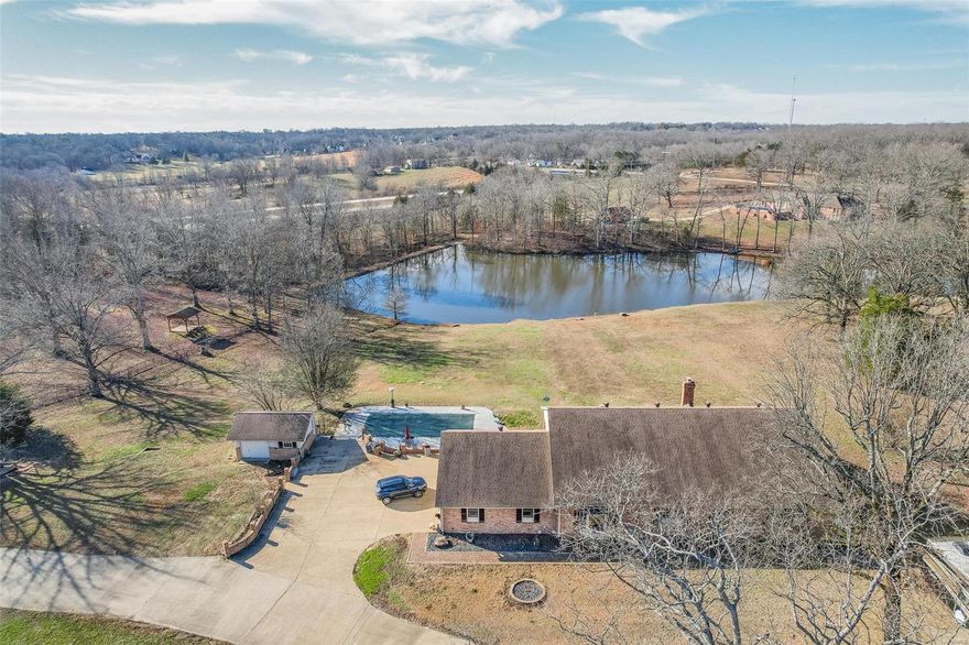 $999,500 1 Breezy Hill. Poplar Bluff, MO 63901. Exceptional Quality Through-Out!  4 bedroom, 4 bath home, full basement, 2 kitchens with Viking Appliances, main kitchen has 2 dishwashers, master bath has a steamer,  2 laundry rooms, 2 fireplaces, in-ground pool with pool house, electric underground dog fence, nice lake with lakeview, 4,684 sq ft   15.23 acres. rare find.