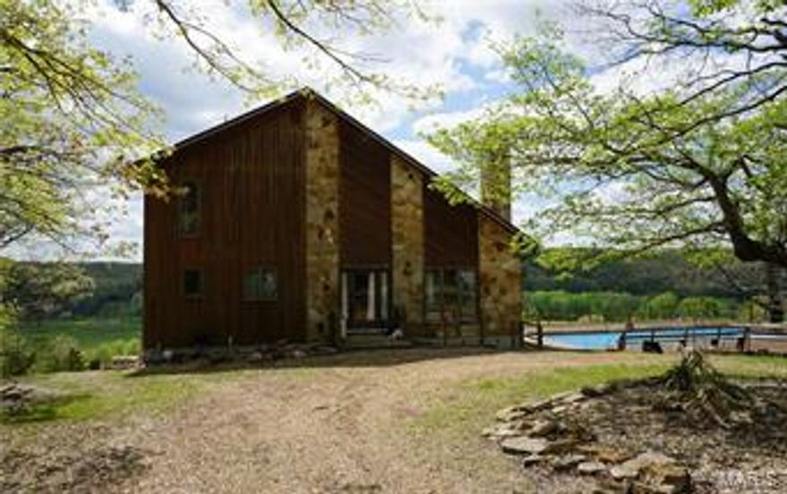 The river views from this incredible property are unmatchable!  This secluded Gasconade River farm has 559 +/- acres with over a mile of river frontage.  There are 7 separate pastures, 4 ponds, a spring, small caves and the Jack Creek runs through the property.  The large 1 bedroom home has 2 baths, beautiful vaulted wood ceilings, a fireplace, a full basement, an office/spare room, central heat & air and is partially furnished.  422 +/- acres are timber and valued at $320,825 (forestry report available).  This property is truly an outdoorsmans dream and offers something for everyone!