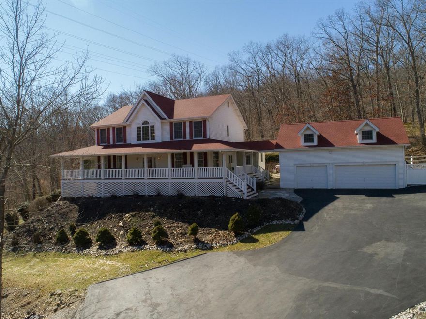 Gorgeous 1.5 stry home perched on 6+/- completely private & secluded acres. Boasting a charming 8’ wide wrap around porch to enjoy the serenity of the acreage, the home flaunts 4 bedrms, 4½ baths, & an oversized 3 car detached garage w/a ready-to-be-finished apt above. 2 stry great rm feat. an accent wall of wood windows w/access door to large deck & a flr-to-ceiling, raised hearth, brick FP, w/electric insert. Kitchen boasts white cabs, wood floors, SS appliances, granite countertops, walk-in pantry, & breakfast nook. ML master suite feat. coffered ceiling & access to private 3 seasons rm & updated bath w/jetted tub, sep. shower, & a dual floating bowl sink vanity. Sunrm, dining rm, & laundry complete the ML. UL embraces 3 bedrms, 1 w/ensuite bath, other 2 share Jack-n-Jill, & an open loft/sitting area. LL extends living quarters w/a rec rm w/WB FP, kitchenette, office/sleeping area, & full bath. Zoned geo-thermal HVAC, newer roof, newer deck. Also includes 5000 Fox Creek Crossing. Additional Rooms: Sun Room