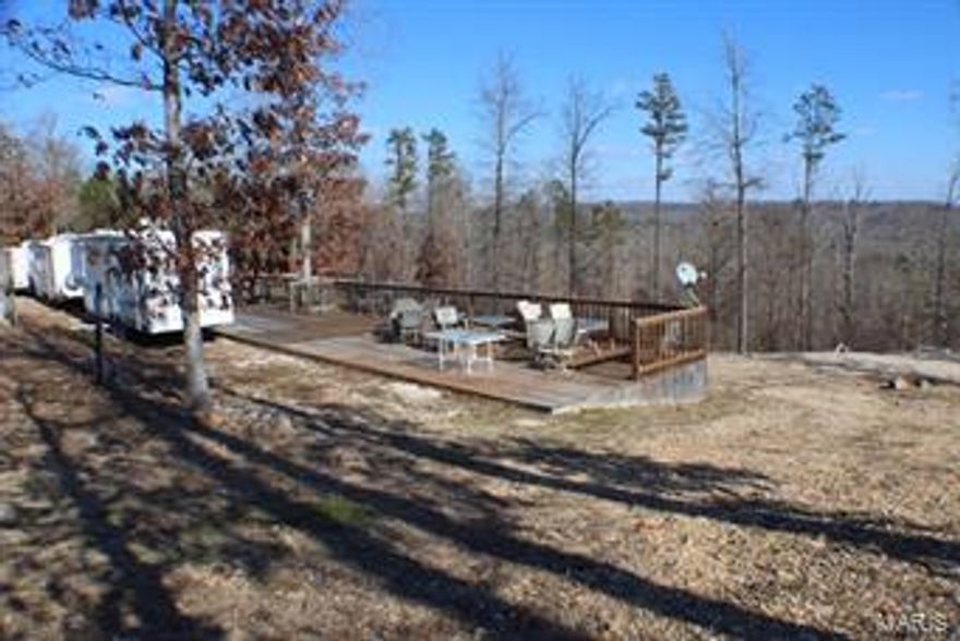 This is the property you have been waiting for and will not last long. 2.56 acres for your very own, year around camping retreat getaway or investment opportunity. This property has 8 camper pads, all with public water, electric hookups and septic. Just minutes from Current River, at the corner of M highway and county road 127. Rent pads by the week, by the month, for the busy summer season or for the year. 2 spacious, freestanding decks are in place to accommodate you and your family.