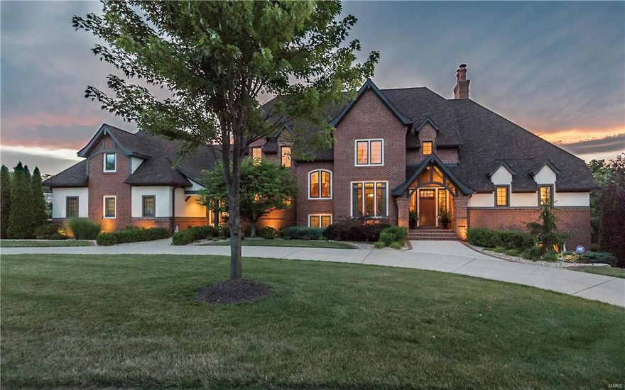 Dick Busch designed home on nearly 2 acres in WindCastle! Schaeffer-built all brick residence enhanced by the finest craftsmanship & meticulous attention to detail. Gracious entry foyer leads to grand room with dramatic vaulted ceilings highlighted by wood beams, masonry fireplace & floor to ceiling windows with transoms. French doors open to handsome library with built-in bookcases. State-of-the-art kitchen with custom cabinetry, granite countertops, professional quality appliances and large center island adjoins breakfast room and hearth room with stone fireplace accented by built in bookcases. Master bedroom offers an appealing retreat featuring, marble bath and access to private deck overlooking the grounds. Second floor features 3 additional bedroom suites. Walk out Lower Level with billiard room, recreation room with gas fireplace, workout room, 1,000 bottle wine cellar, 5th bedroom & full bath. Professionally landscaped grounds include 2 patios, screened-in-porch, & 4-car garage Additional Rooms: Mud Room