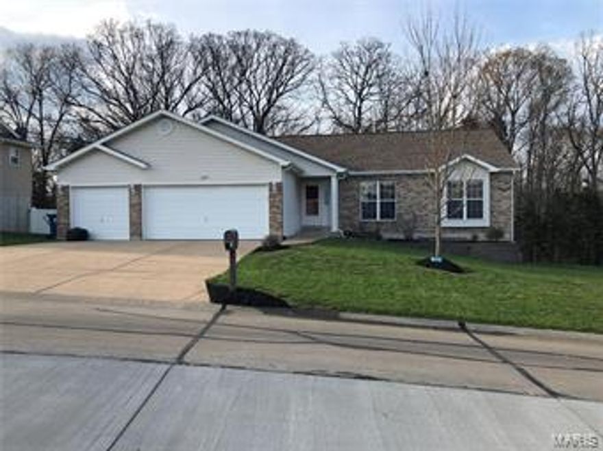 Don't miss out on the MOVE IN READY 3 BED 3 BATH family home in the desirable Hillsboro School District.  The large 3 car garage will give you plenty of room for all your toys.  The home features just over 2000 sq ft of total living space right in town within walking distance to schools and restaurants.  All new laminate floors on the main level.  The home sits on .51 acres and backs to woods offering privacy while enjoying the covered back porch.  The partially fenced back yard is perfect for your pets.  The kids will love the 15' above ground pool that has 1 full summer of usage.  The finished basement is great for entertaining with the large bar area as well as the full bathroom.  New appliances installed in 2016.  The HVAC was upgraded in Aug 2016.  A new water heater was installed in Sept 2016.  Light fixtures and ceiling fans have also been updated.  The home is truly move in ready and will not last long.