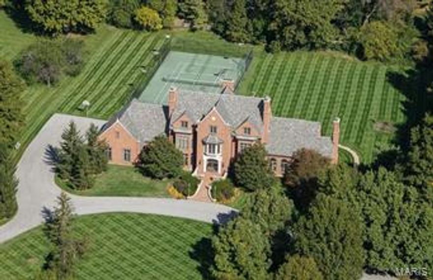 Sharp New Price makes this exceptional 3.0 acre estate the best overall value in Ladue. Selected by KMOV TV4 Great Day St. Louis, for it's segment "The Finest Luxury Homes of Saint Louis". As the TV reporter said, "This place looks like Wayne Manor!!" Designed after Mansions of the Central West End but reinvented w/amenities of modern living. A tennis lover's paradise w/lighted court this 3-story Higginbotham built home is remarkable. 1.5 story w/a main level Master wing that includes 2 baths and a private den. Elevator to 4 levels. Expansive circular drive. 3-story staircase. 6 en-suite Bedrooms/9 Baths/9 Fireplaces/4 car heated garage. Classic 24-foot Dining Room, Formal Living Room, kitchen w/Hearth & Breakfast rooms, Great Room. Ludowici clay tile roof. Massive walkout LL [new paint 2015]. Seller credit for new LL flooring. Tennis court also may be used as Sports Court for basketball, roller hockey, etc. Plans for pool addition, available.