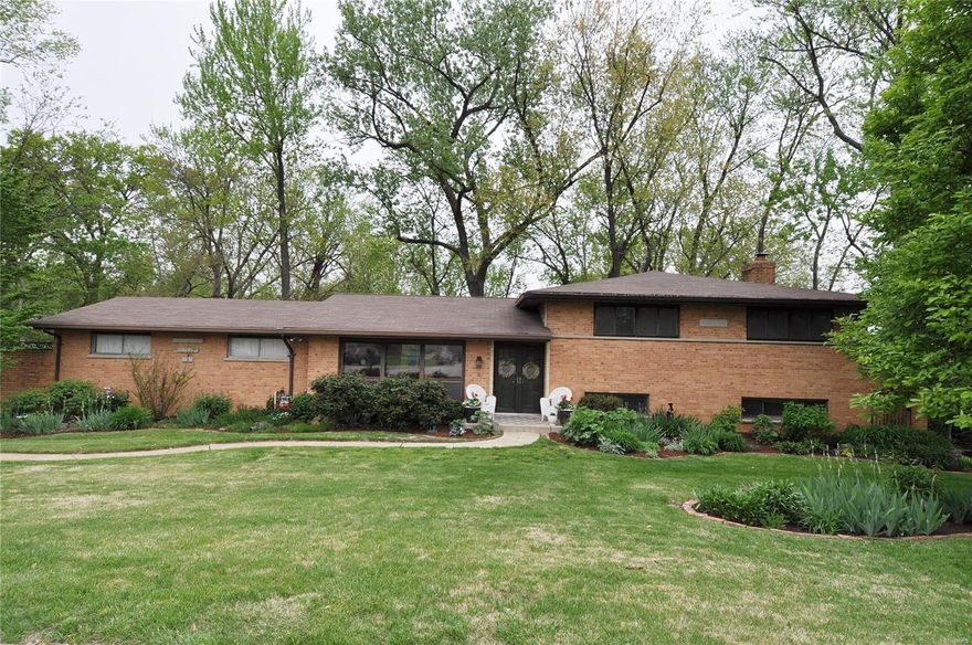 Est. 1958: Wonderful mid-century Olivette all-brick multi-level home featuring a great, livable floor plan w/lots of extra spaces & FANTASTIC updates! Step inside to a formal entryway w/closet that leads into an open concept formal living & formal dining room w/hardwood floors & fireplace, then into a gorgeous, fully renovated chefs kitchen w/custom cabinetry, high-end appliances, quartz counters & skylight. The upper level leads you to 3 generously sized bedrooms, including a primary suite w/pvt full bath, and an updated hall bath. Downstairs, the walkout at-grade level offers a spacious rec/family room, two addt'l rooms (great offices or guest spaces) & half bath. Plus, an addt'l finishable level offers laundry & loads of storage. Not to mention an attached 2-car garage & spacious, very private, lush landscaped park-like yard! Tucked away on a quiet cul-de-sac, this friendly neighborhood is centrally located near amenities, shopping, & more in sought-after Ladue Schools! HURRY!